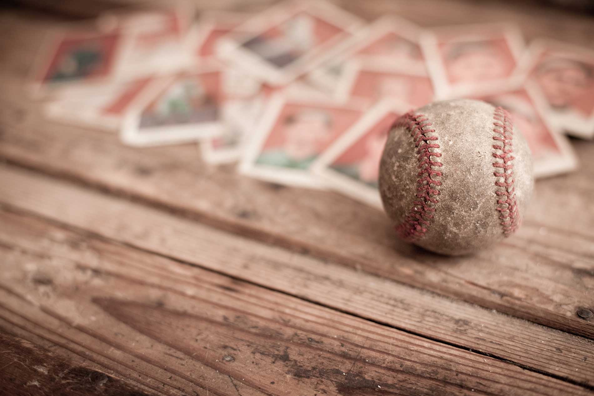 baseball surrounded by playing cards in the background