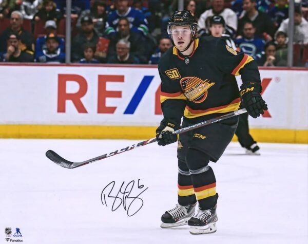 Brock Boeser Vancouver Canucks Autographed 16" x 20" Black Jersey Skating Photograph