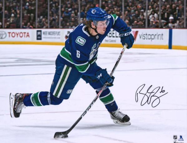 Brock Boeser Vancouver Canucks Autographed 16" x 20" Blue Jersey Shooting Photograph