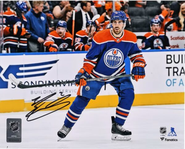 Evan Bouchard Edmonton Oilers Autographed 16" x 20" Blue Jersey Skating Photograph with "Lets Go Oilers!" Inscription