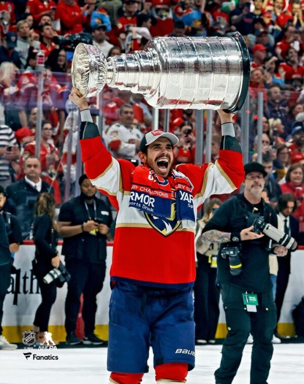 Evan Rodrigues Florida Panthers Unsigned 2024 Stanley Cup Champions Raising Cup Photograph