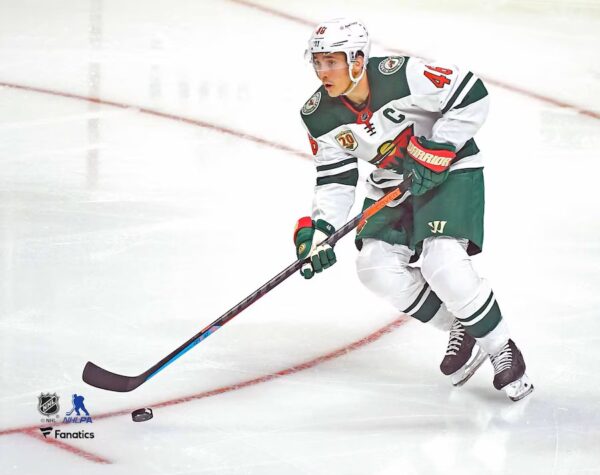 Jared Spurgeon Minnesota Wild Unsigned White Jersey Skating with Puck vs. Los Angeles Kings Photograph