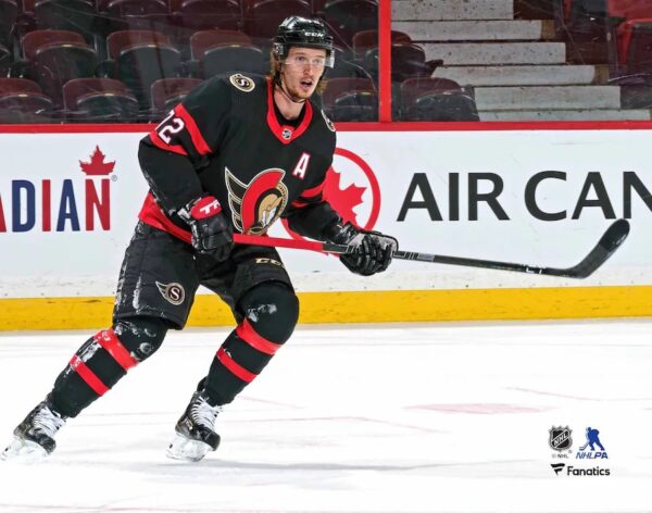 Thomas Chabot Ottawa Senators Unsigned Black Jersey Skating vs. Winnipeg Jets Photograph